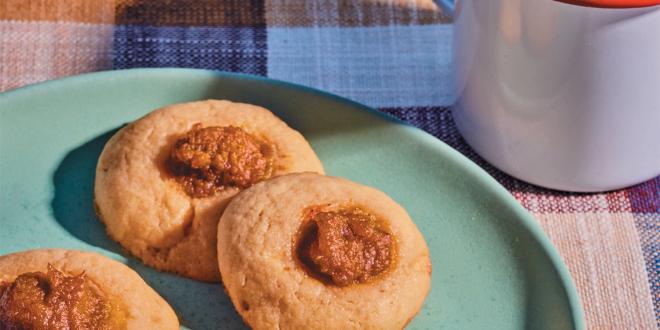 a plate of sugar cookies with dollops of pumpkin pie filling